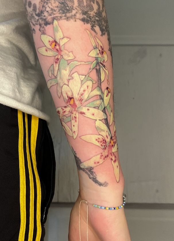 26 Orchid Tattoo Ideas for Minimalist, Colour, and Fine Line Designs