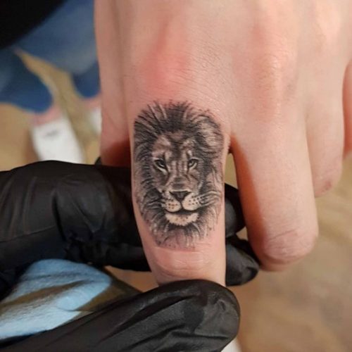 Fierce and Detailed: 19 Lion Tattoo on Finger Ideas