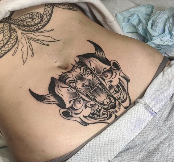 22 Ideas for Lower Stomach Tattoos: Stunning Designs and Unique Personal Statements