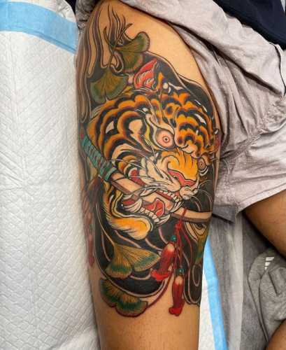 25 Tiger Tattoo on Thigh Ideas