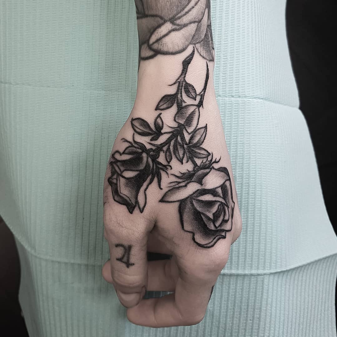 27 Rose Hand Tattoo Ideas: From Classic Black-and-Gray to Bold Narrative Pieces
