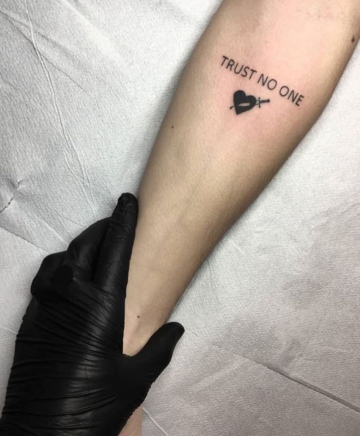 25 Trust No One Tattoo Designs with Lettering, Fonts, Ideas for Men and Women