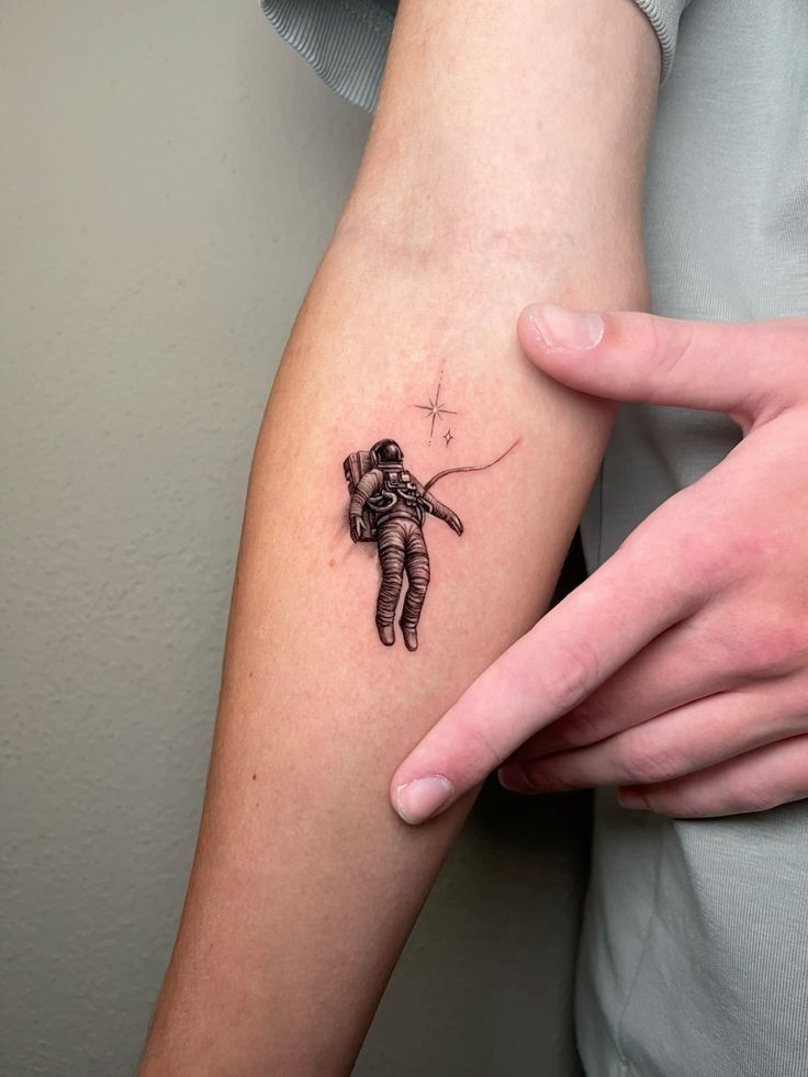 Astronaut Tattoo Ideas for Men and Women Minimalist, Stencil Outline, and Cosmic Designs
