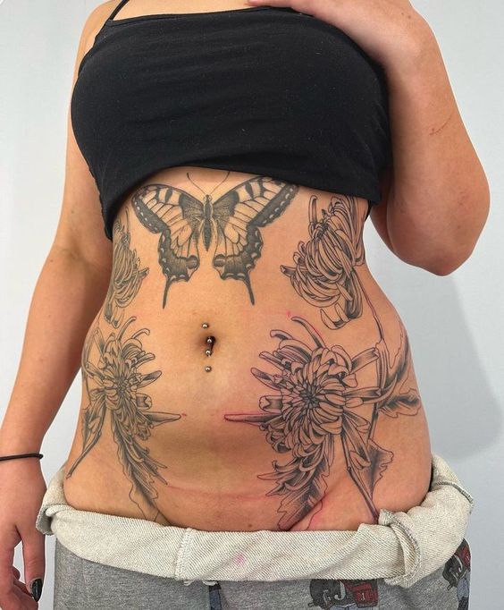 22 Ideas for Lower Stomach Tattoos: Stunning Designs and Unique Personal Statements