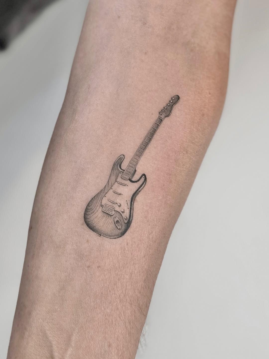 31 Guitar Tattoo Ideas for Music Lovers: From Minimalist Designs to Bold Sleeve Art