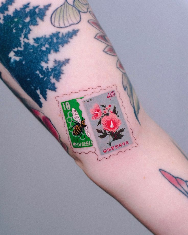 30 Unique Stamp Tattoo Ideas with Travel, Floral, Vintage, Fine Line, and Matching Postage Designs