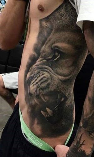 Expressive and Bold: 18 Lion Tattoo on Ribs