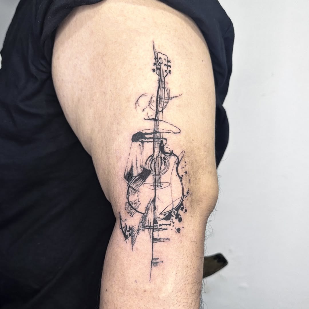 31 Guitar Tattoo Ideas for Music Lovers: From Minimalist Designs to Bold Sleeve Art
