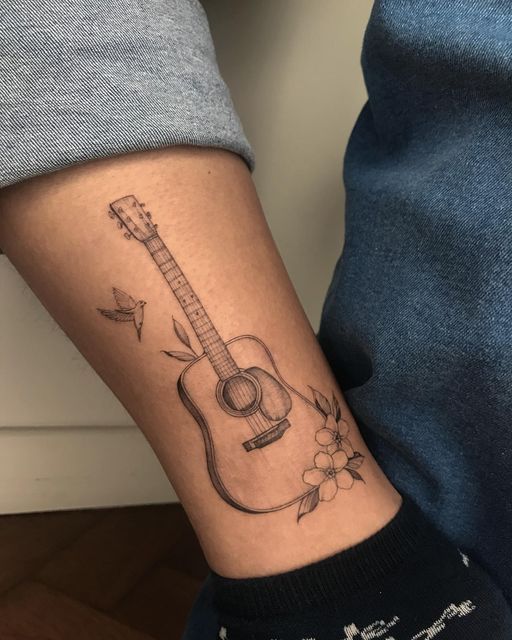 31 Guitar Tattoo Ideas for Music Lovers: From Minimalist Designs to Bold Sleeve Art