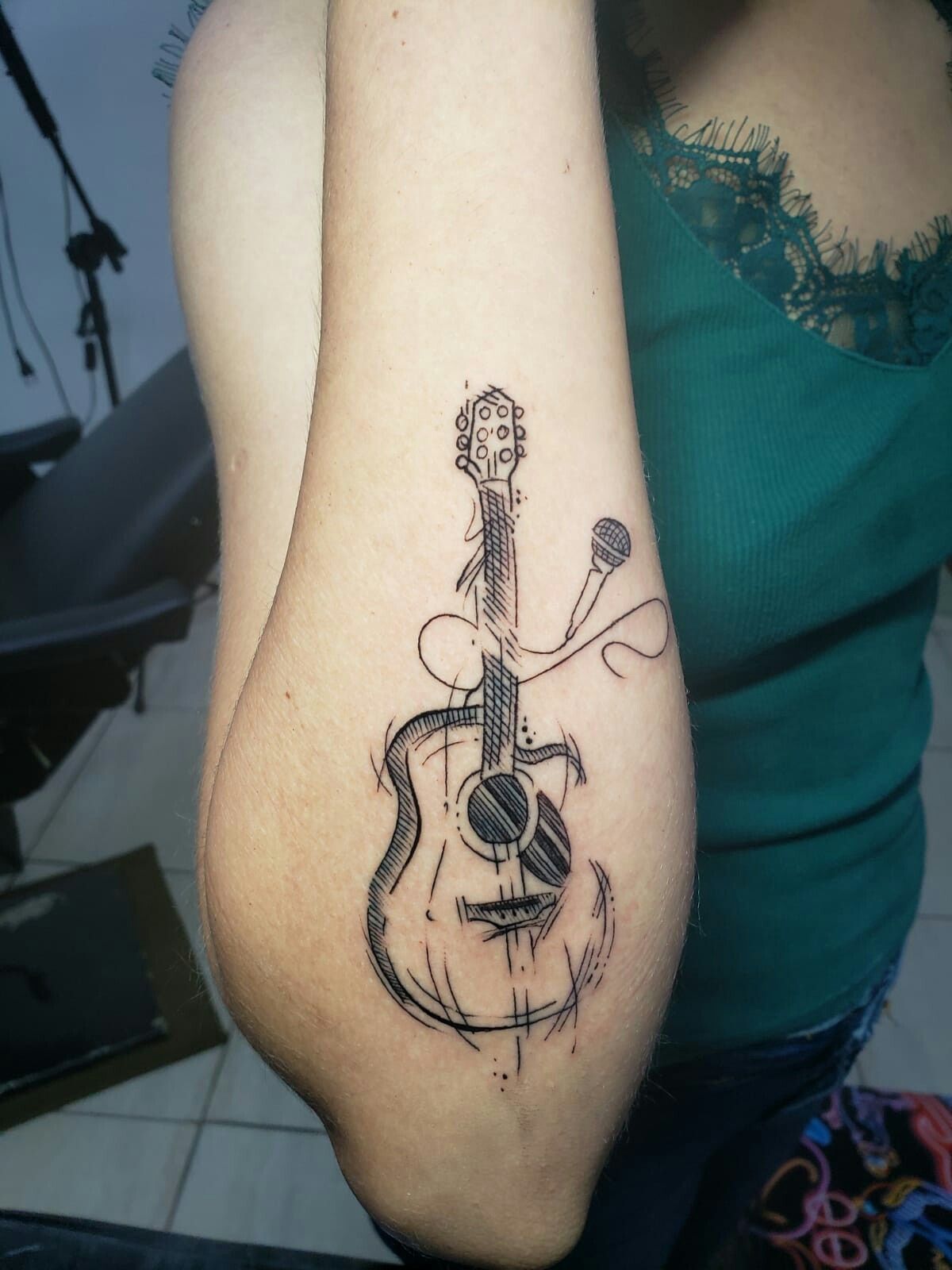 31 Guitar Tattoo Ideas for Music Lovers: From Minimalist Designs to Bold Sleeve Art