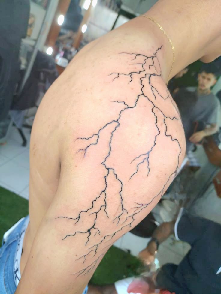 28 Lightning Tattoo Ideas for Men and Women: Arm, Shoulder, Chest, Hand, and Leg Designs