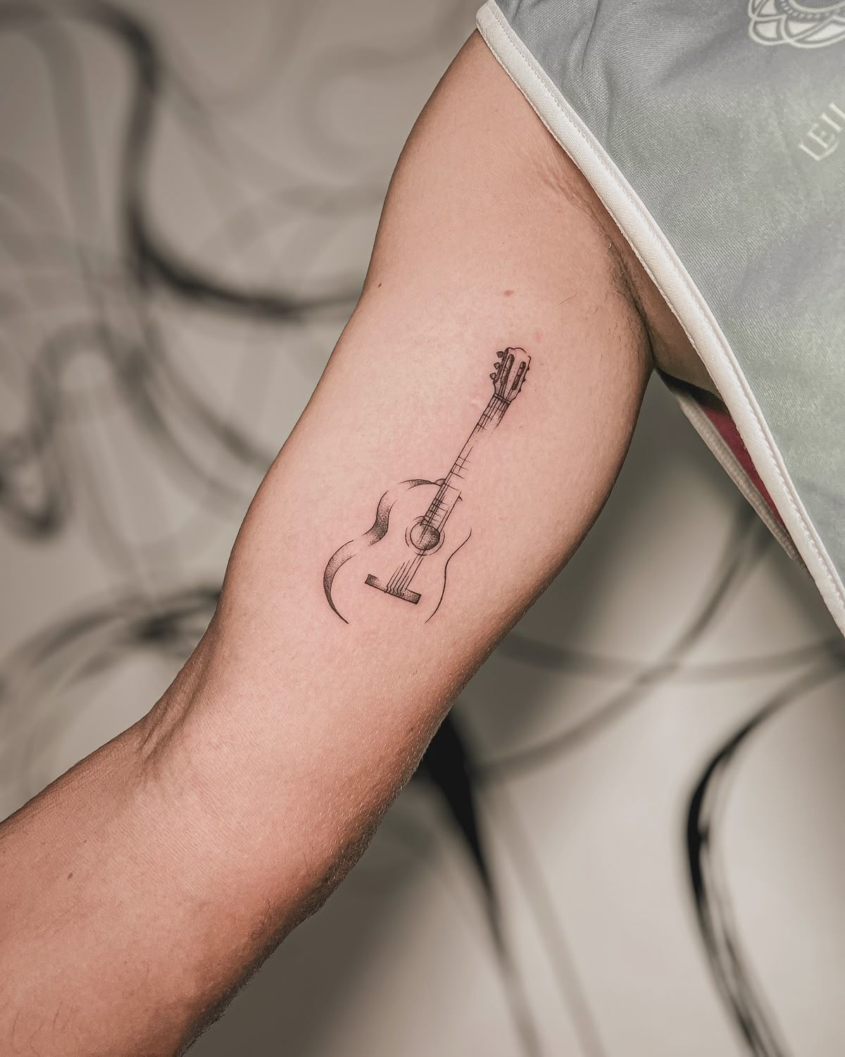 31 Guitar Tattoo Ideas for Music Lovers: From Minimalist Designs to Bold Sleeve Art