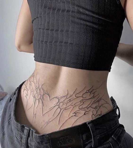 18 Stunning Lower Back Tattoo Ideas for Women & Men: Classy & Artistic Inspiration