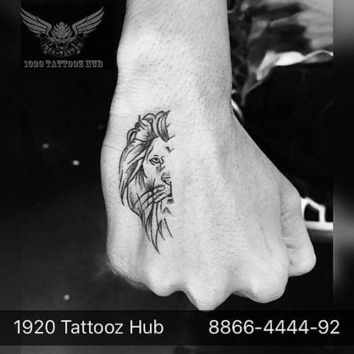 27 Minimalist Lion Tattoo: Subtle Elegance and Symbolism