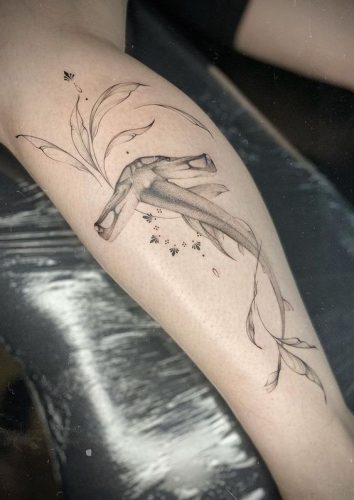 Explore 18 Stunning Shark Tattoo Designs for : From Elegant Minimalism to Vibrant Watercolors