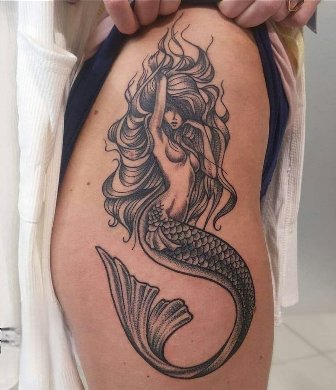 27 Mermaid Tattoo Ideas With Minimalist, Traditional, Afro, Siren, and Barbie-Inspired Designs