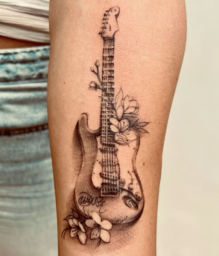 31 Guitar Tattoo Ideas for Music Lovers: From Minimalist Designs to Bold Sleeve Art