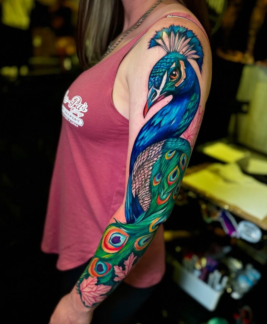 The Symbolic Splendor of Peacock Tattoos: Powerful Designs That Speak for Themselves