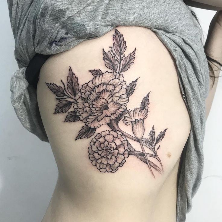 26 Marigold Tattoo Ideas for Every Style Fineline, Realistic, Black and White, Traditional, and Color Designs