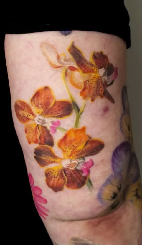 26 Orchid Tattoo Ideas for Minimalist, Colour, and Fine Line Designs