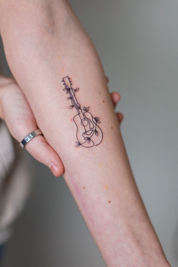 31 Guitar Tattoo Ideas for Music Lovers: From Minimalist Designs to Bold Sleeve Art