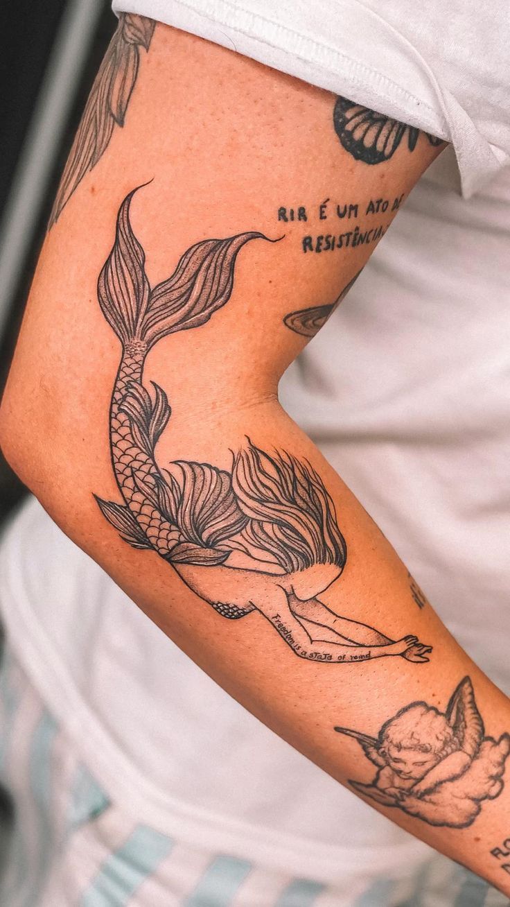 27 Mermaid Tattoo Ideas With Minimalist, Traditional, Afro, Siren, and Barbie-Inspired Designs