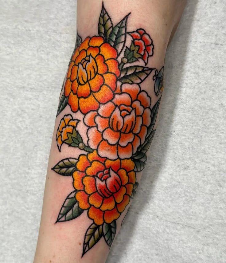 26 Marigold Tattoo Ideas for Every Style Fineline, Realistic, Black and White, Traditional, and Color Designs