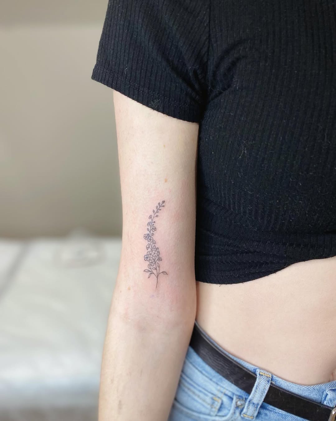 28 Larkspur Tattoo Ideas: Delicate July Blooms with Big Meaning