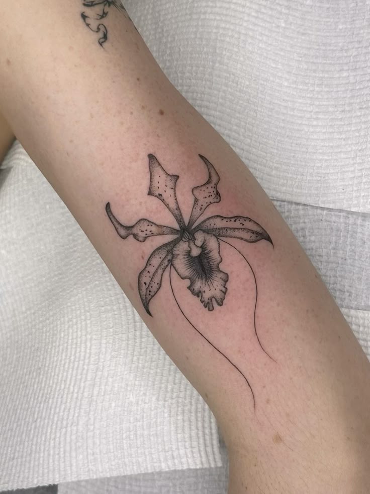 26 Orchid Tattoo Ideas for Minimalist, Colour, and Fine Line Designs