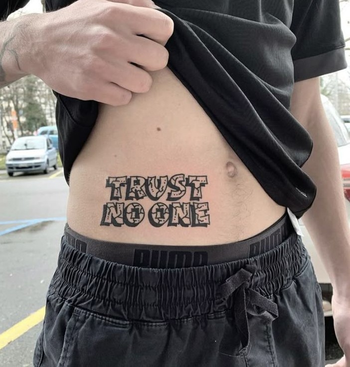 25 Trust No One Tattoo Designs with Lettering, Fonts, Ideas for Men and Women