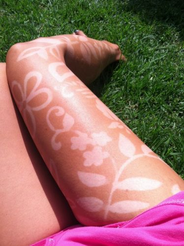 15 Creative Tan Tattoo Ideas for : Embrace the Sun with Stylish Skin Art