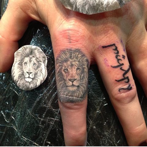 Fierce and Detailed: 19 Lion Tattoo on Finger Ideas