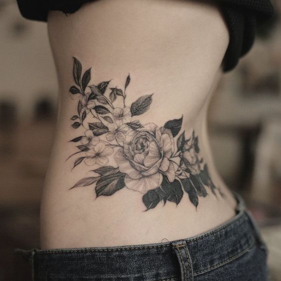 18 Stunning Lower Back Tattoo Ideas for Women & Men: Classy & Artistic Inspiration