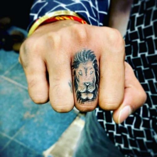 Fierce and Detailed: 19 Lion Tattoo on Finger Ideas