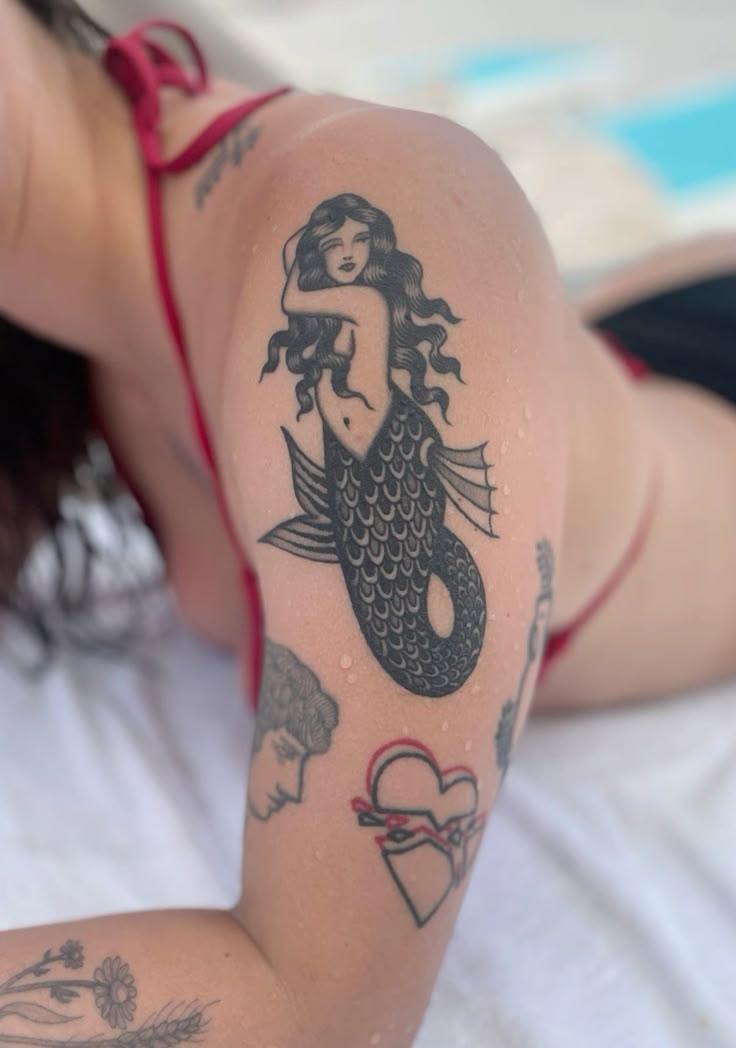 27 Mermaid Tattoo Ideas With Minimalist, Traditional, Afro, Siren, and Barbie-Inspired Designs