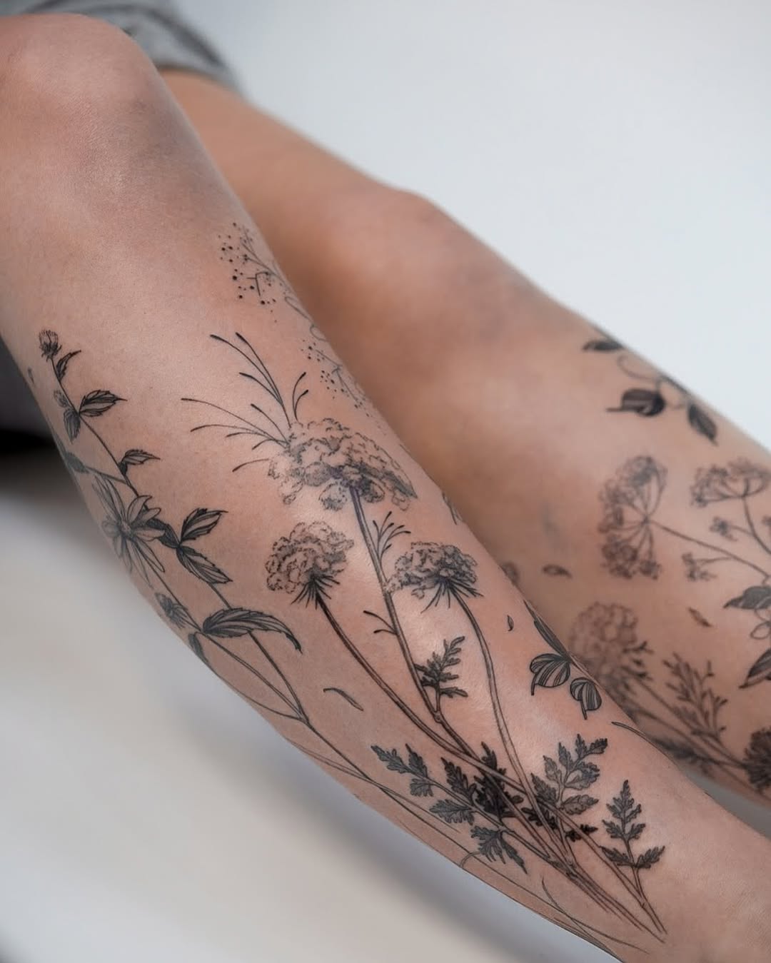 29 Wildflower Tattoo Ideas: Dainty Fine Line, Arm Sleeves, Ankle Wraps, Minimalist Shoulder Designs