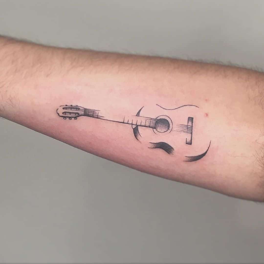 31 Guitar Tattoo Ideas for Music Lovers: From Minimalist Designs to Bold Sleeve Art