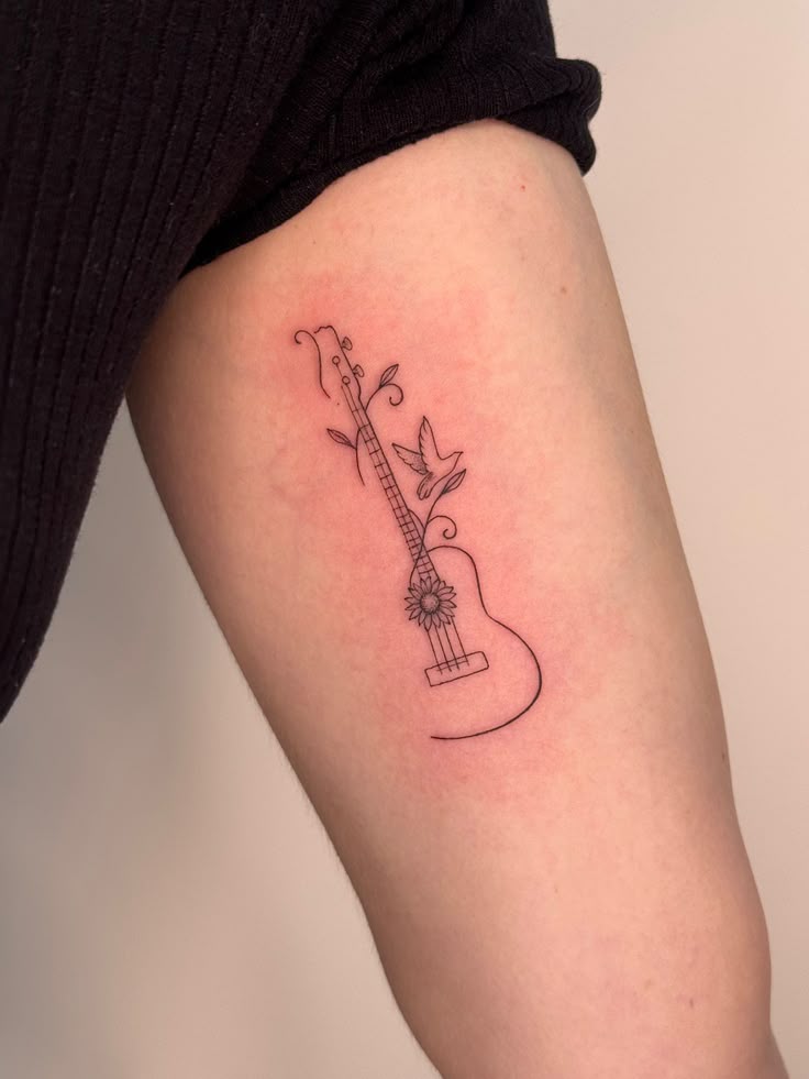 31 Guitar Tattoo Ideas for Music Lovers: From Minimalist Designs to Bold Sleeve Art