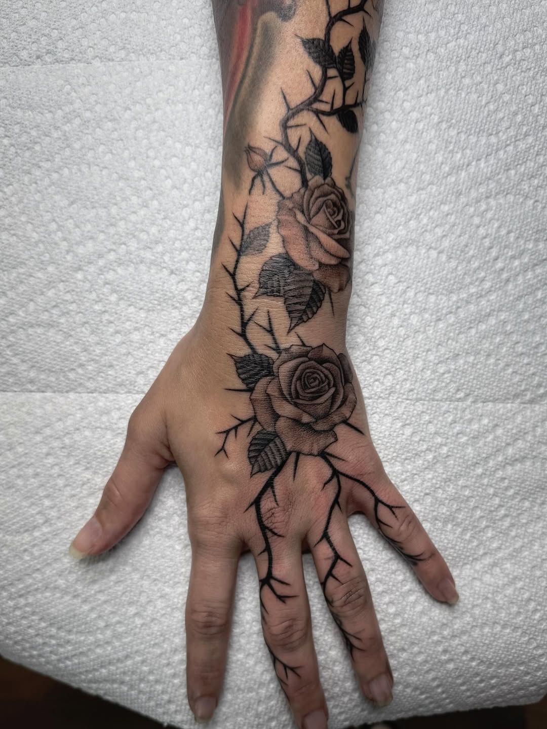 27 Rose Hand Tattoo Ideas: From Classic Black-and-Gray to Bold Narrative Pieces
