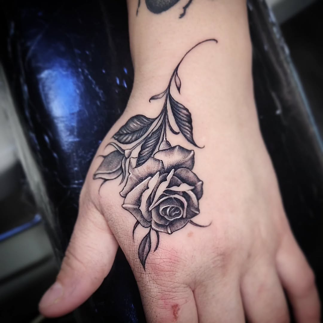 27 Rose Hand Tattoo Ideas: From Classic Black-and-Gray to Bold Narrative Pieces