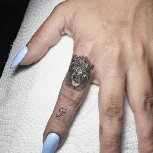Fierce and Detailed: 19 Lion Tattoo on Finger Ideas