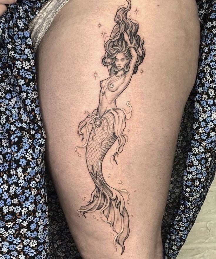 27 Mermaid Tattoo Ideas With Minimalist, Traditional, Afro, Siren, and Barbie-Inspired Designs