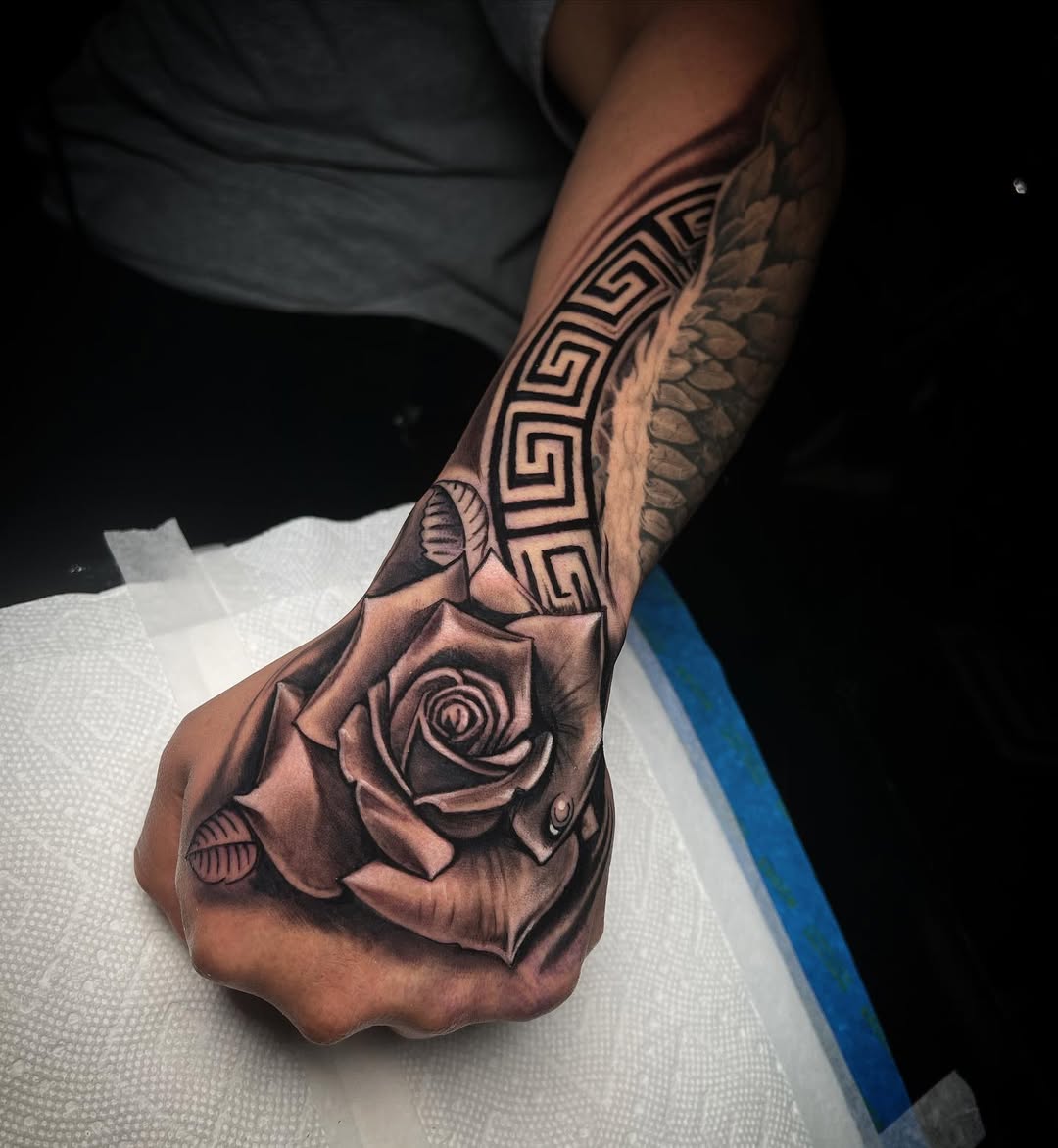 27 Rose Hand Tattoo Ideas: From Classic Black-and-Gray to Bold Narrative Pieces