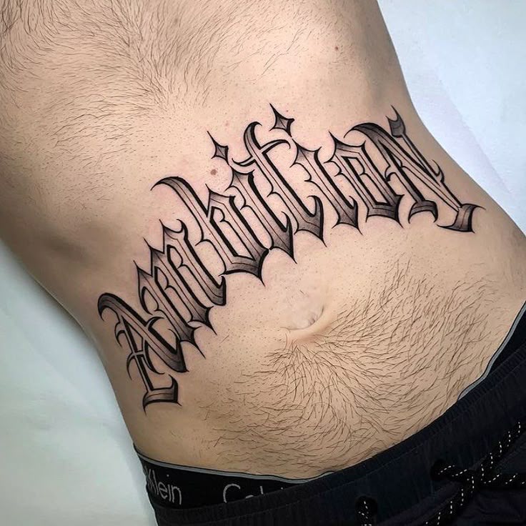 26 Lettering Tattoo Ideas for Men: Bold Fonts, Chicano, Japanese, Vertical, Fine Line & More