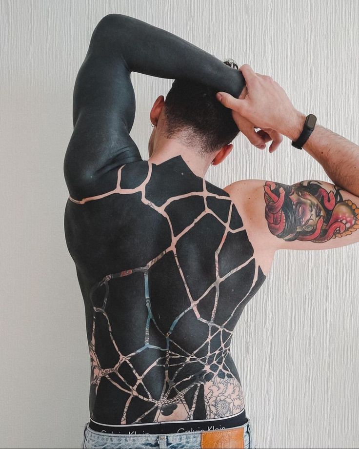 Discover Bold Blackout Tattoo Ideas : Full Sleeve, Geometric, Abstract, with White Ink