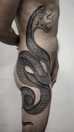 21 Mesmerizing Snake Tattoos on Stomach Ideas