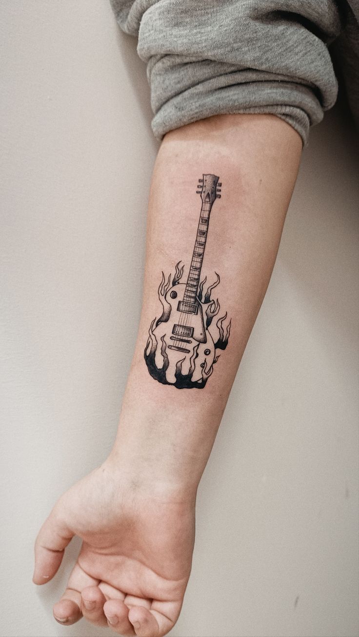 31 Guitar Tattoo Ideas for Music Lovers: From Minimalist Designs to Bold Sleeve Art
