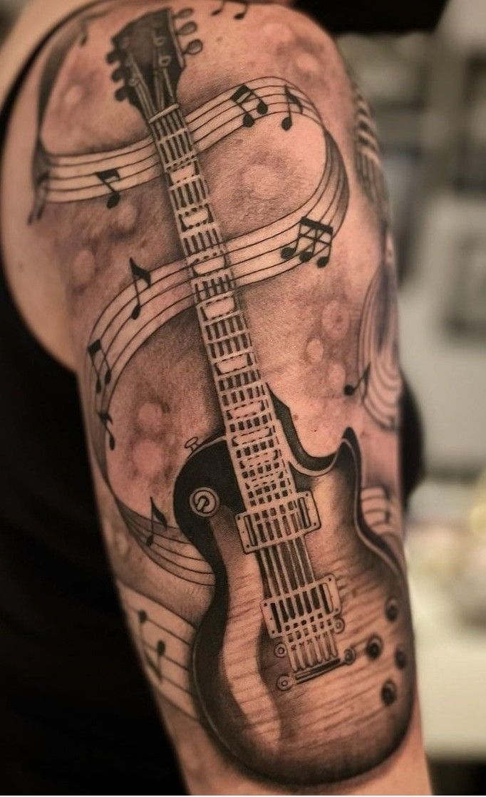 31 Guitar Tattoo Ideas for Music Lovers: From Minimalist Designs to Bold Sleeve Art