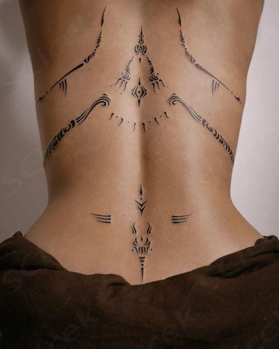 18 Stunning Lower Back Tattoo Ideas for Women & Men: Classy & Artistic Inspiration