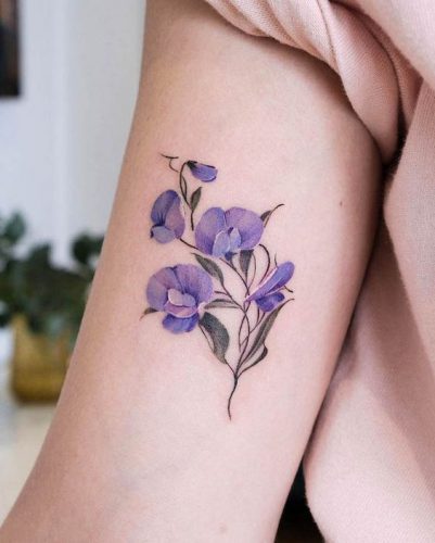 Discover the Charm of February Birth Flower Tattoos: Violets & Primroses Ink Ideas
